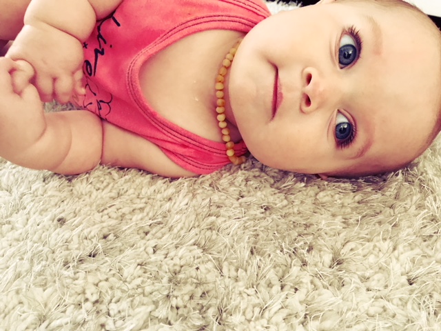 Cute baby model with big blue eyes