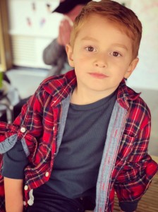 5-year-old model in tee and red flannel