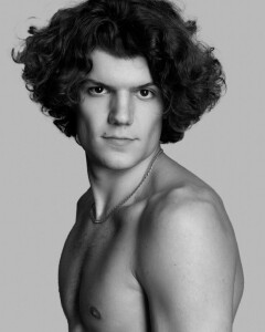 Male model with angular face and wavy, cool hair